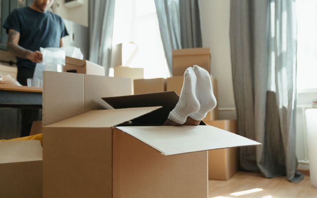 Moving boxes in an empty apartment ready for a changeover clean